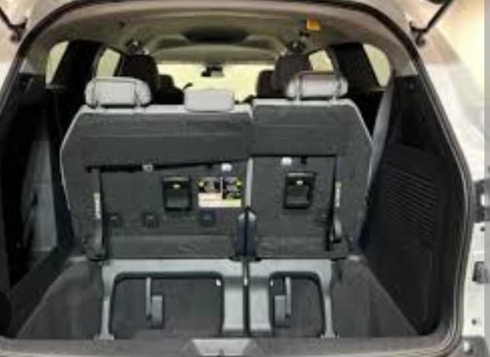 Minivan cargo area Rear cargo area of a minivan with seats folded down.